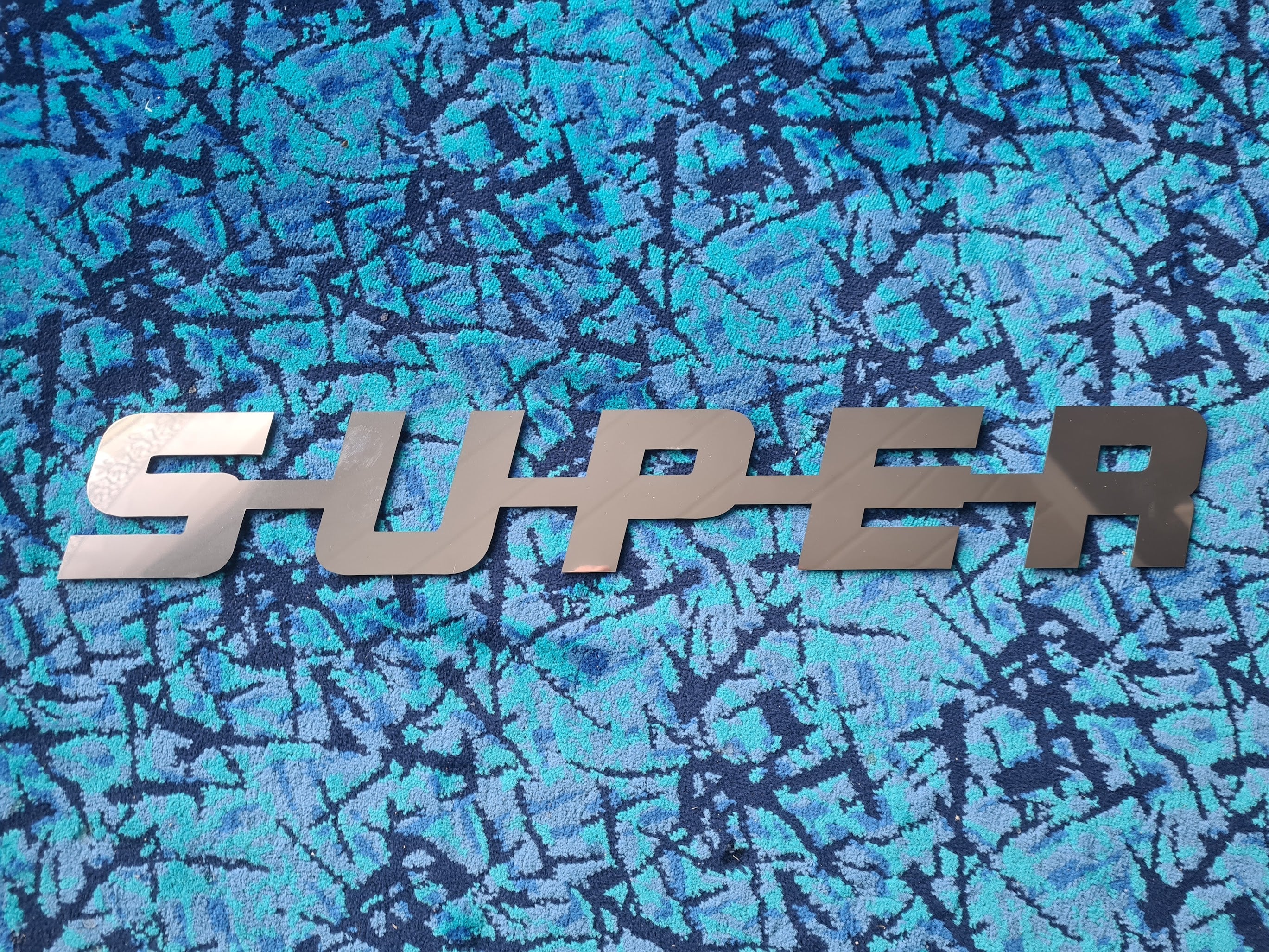 SUPER Emblem in Stainless Steel